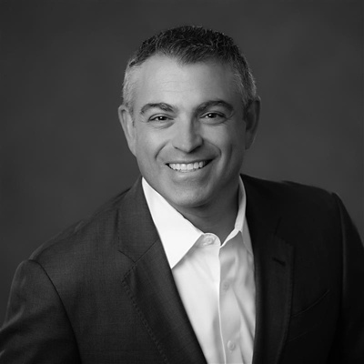 a man in a suit smiling