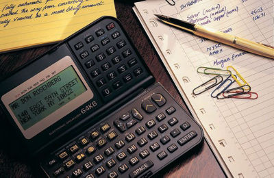 a calculator and paper clips on a desk
