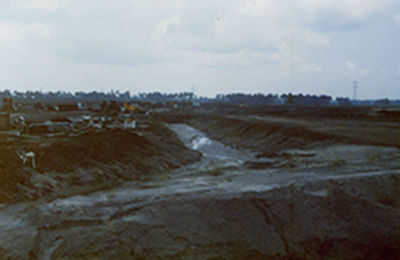 a river flowing through a muddy area