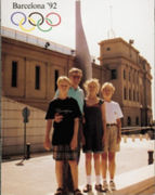 A photo of Charles Koch and his family standing outside a building at the 1992 Summer Olympics in Barcelona, Spain.