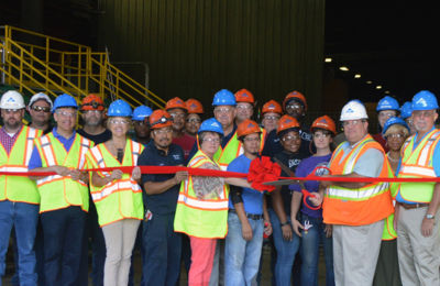 a group of people wearing safety vests and helmets