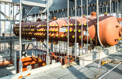 a large metal pipe with yellow dots