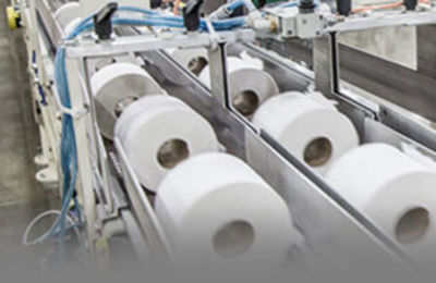 a machine with rolls of paper