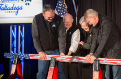 a group of people cutting a flag