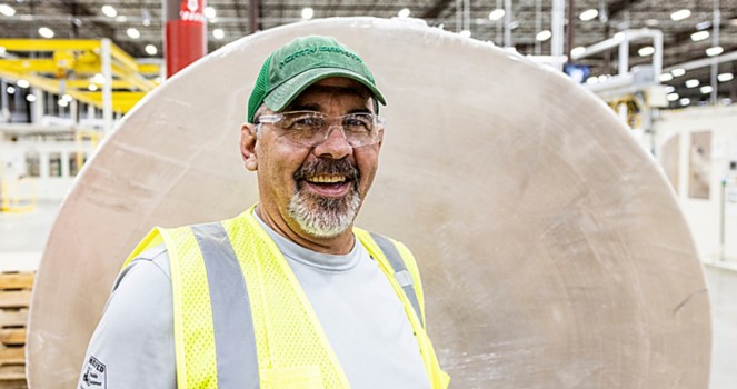 a man wearing a safety vest and glasses