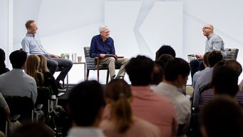 a group of people sitting in chairs