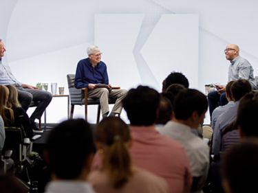 a group of people sitting in chairs