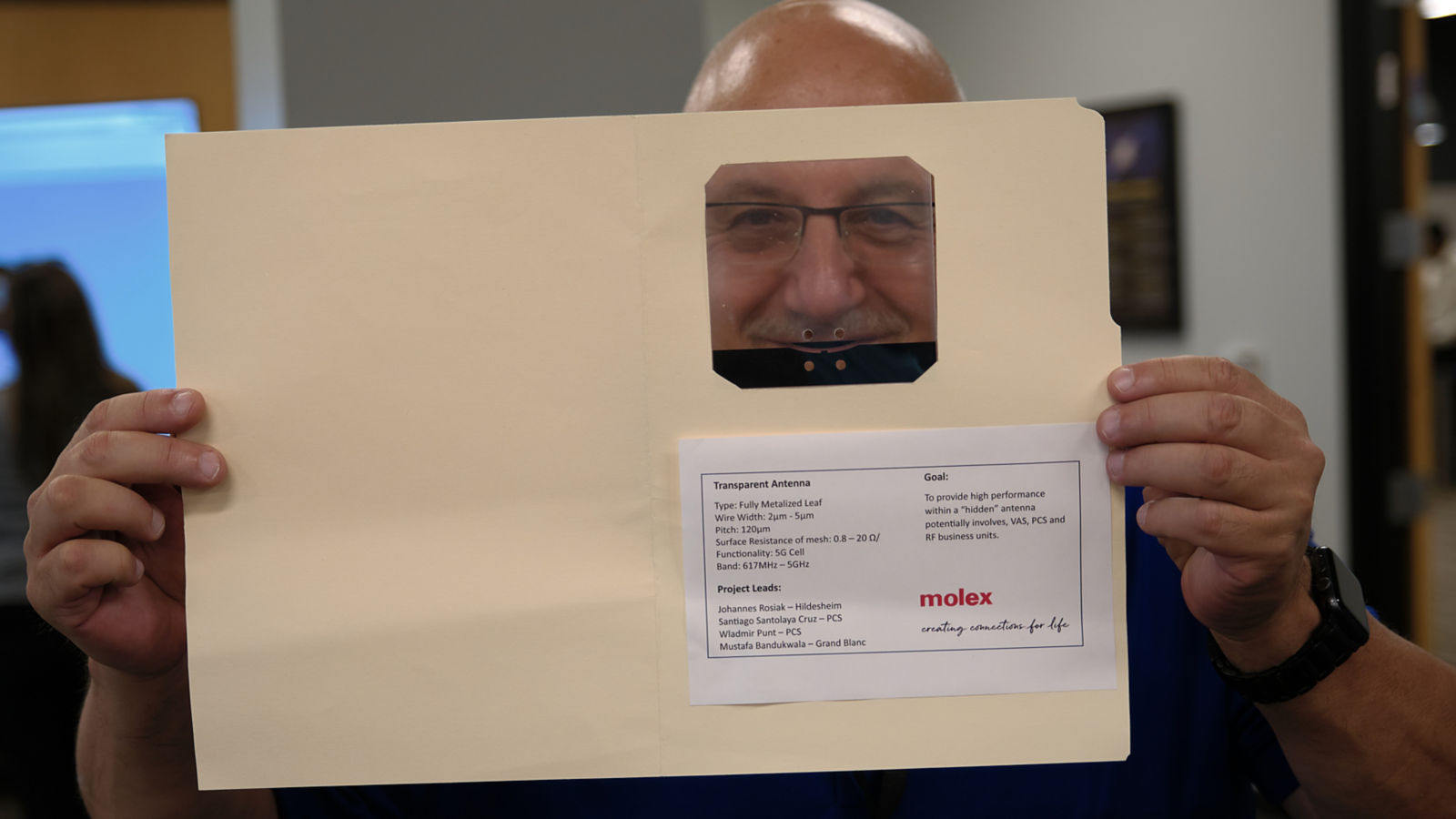 a man holding a file folder