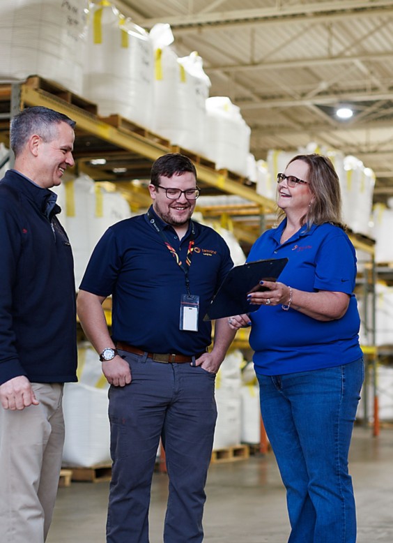 a group of people in a warehouse