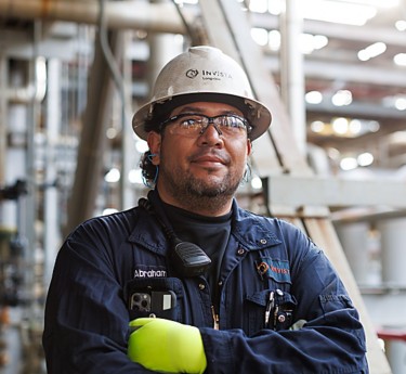 a man wearing a hard hat and glasses