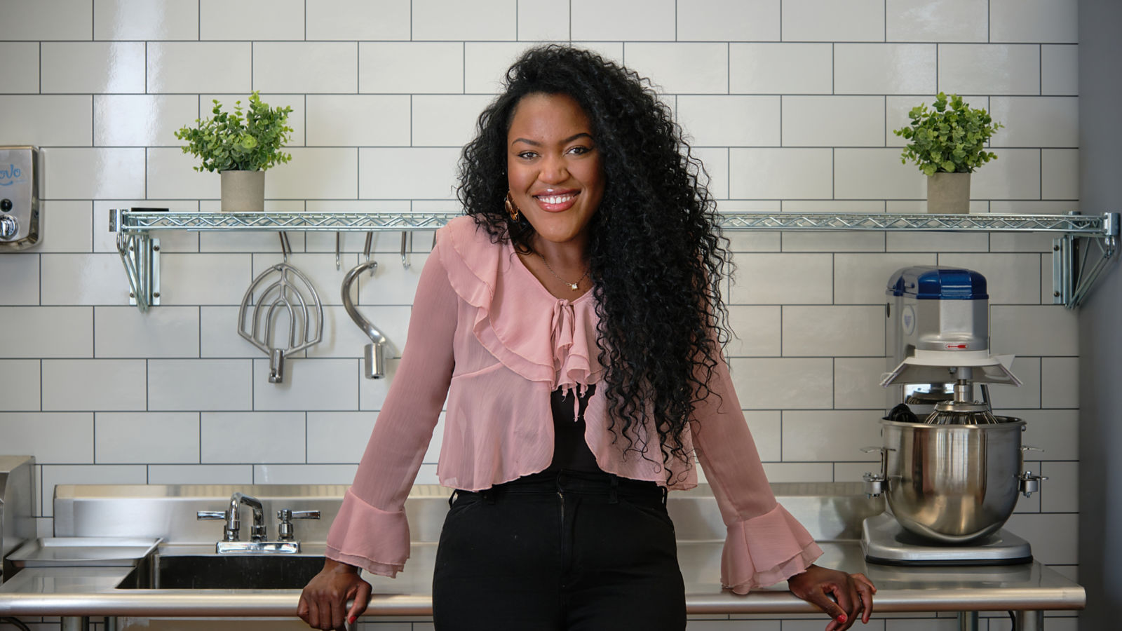 a woman standing in a kitchen