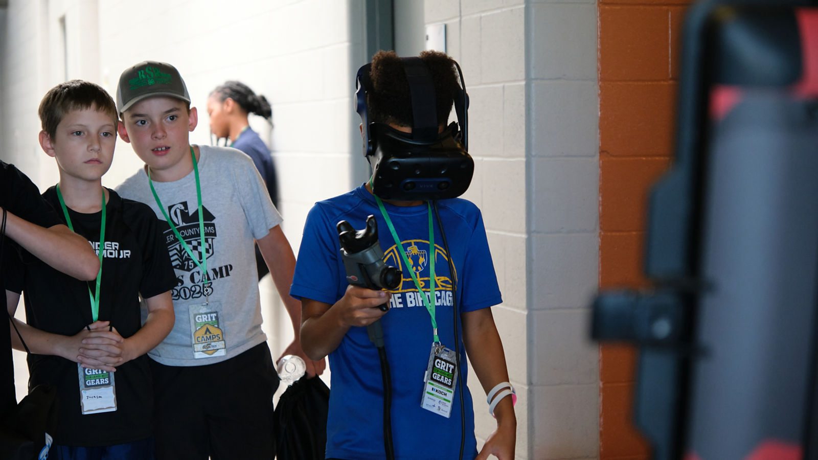 a boy wearing a virtual reality helmet