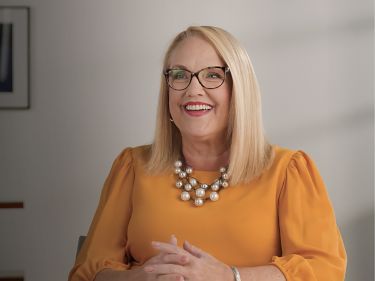a woman in a yellow shirt