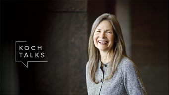 a woman smiling with long hair