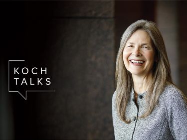 a woman smiling with long hair