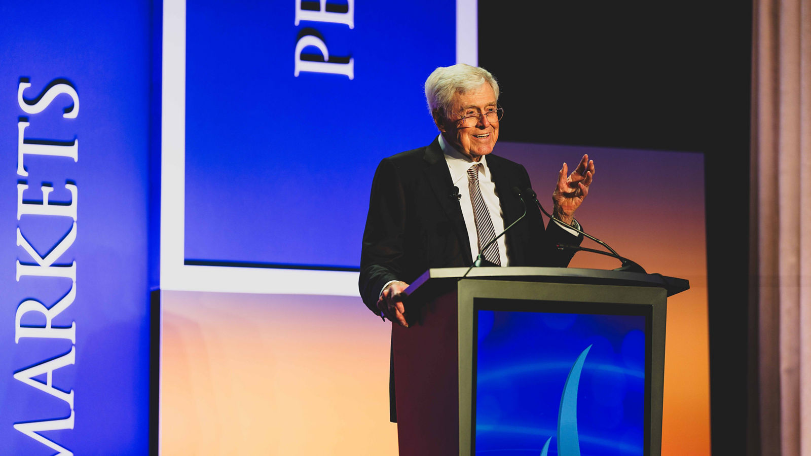 a man standing at a podium