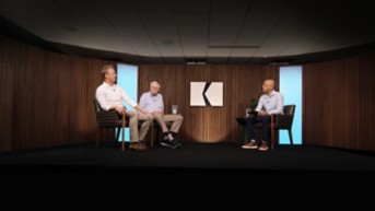 a group of men sitting in chairs
