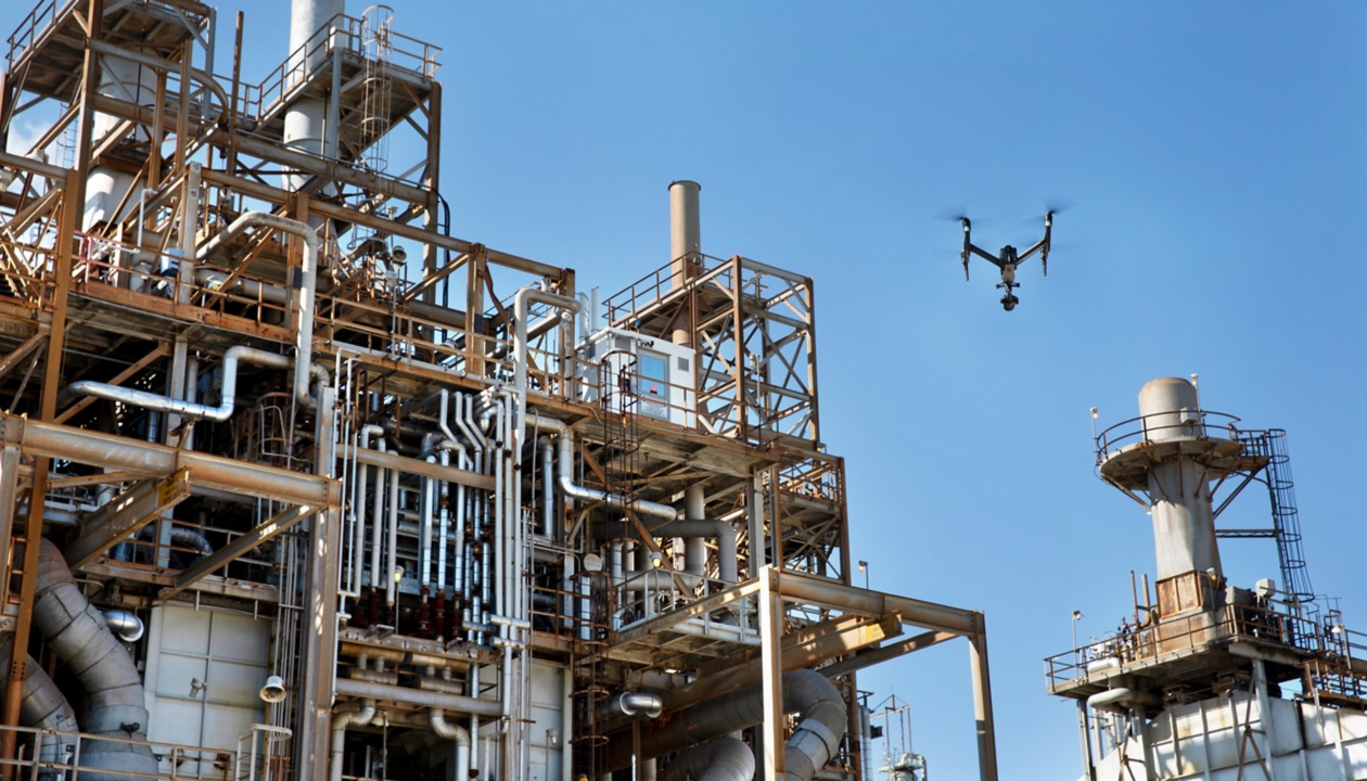 a drone flying over a factory