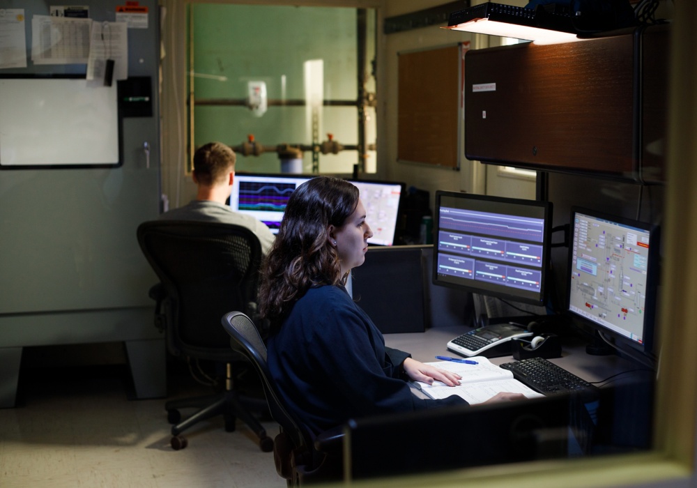 a woman and man working on computers