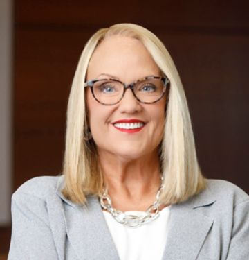 a woman in a grey suit