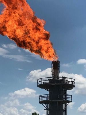 a fire coming out of a tower