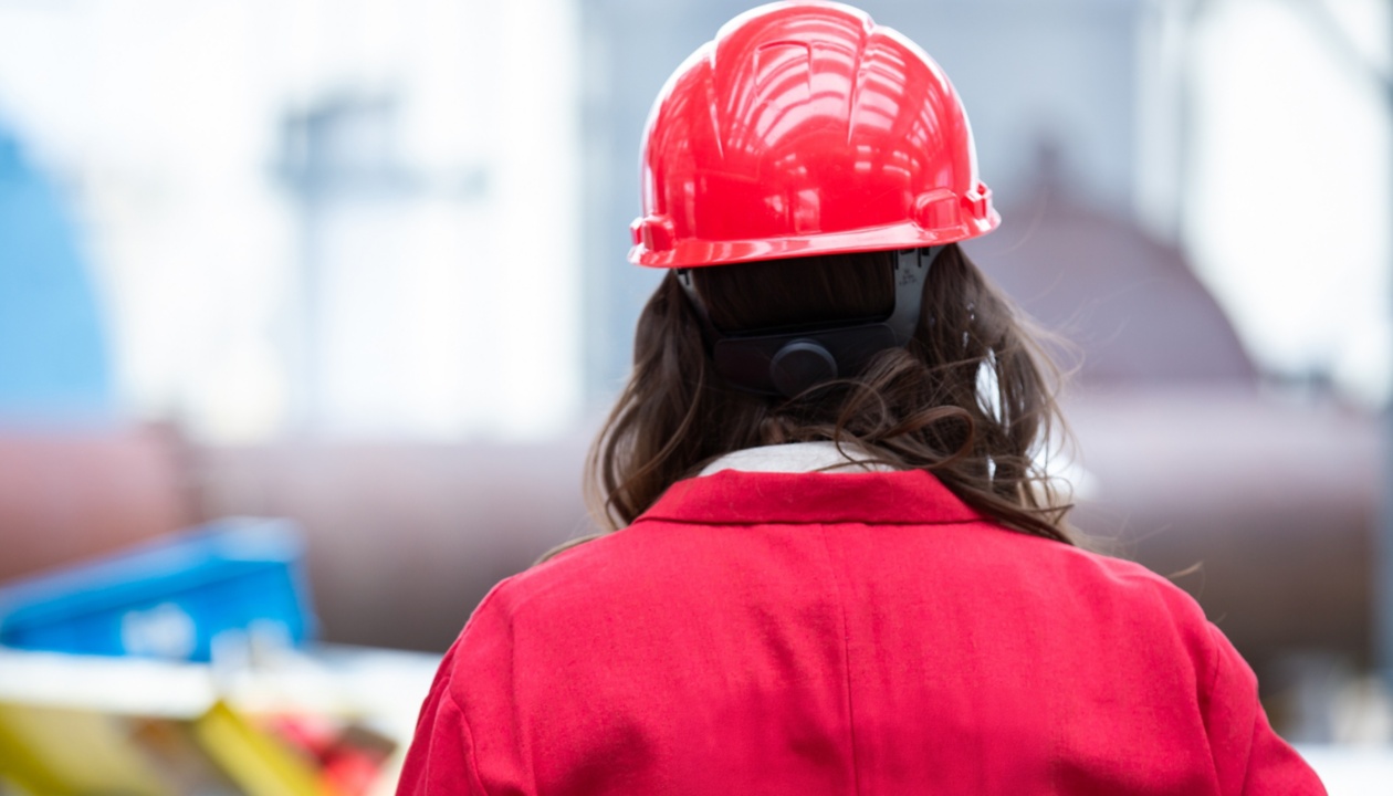 a person wearing a red hard hat