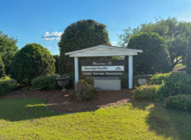 a sign in front of a building