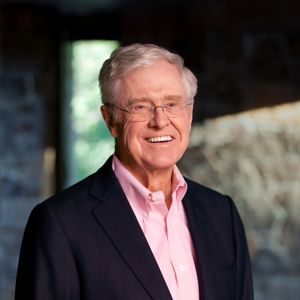 a man in a suit smiling