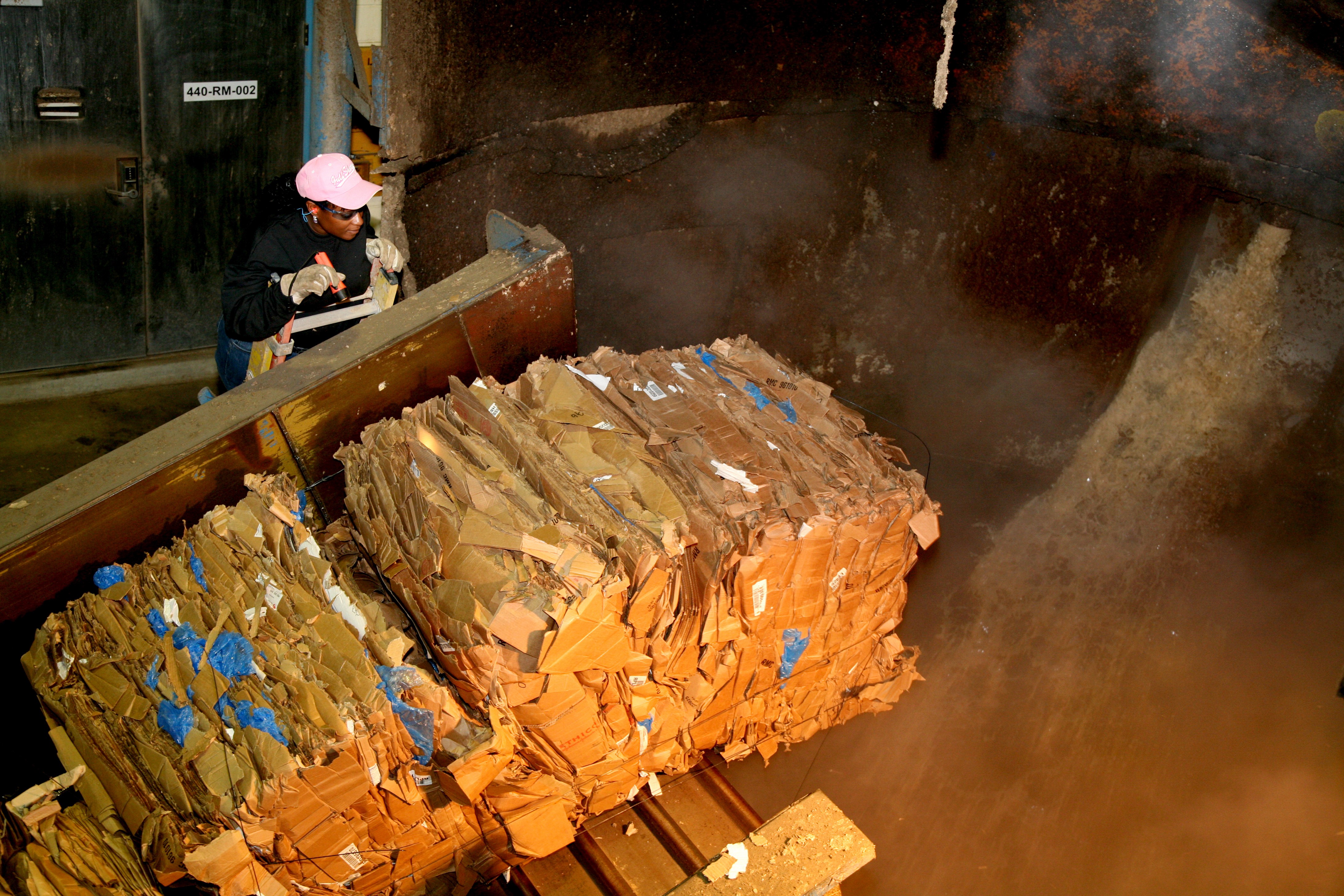 Georgia-Pacific employee processes recycled corrugated materials.