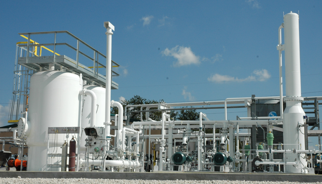 a factory with white pipes