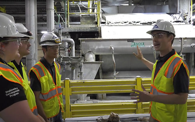 a group of men in safety vests