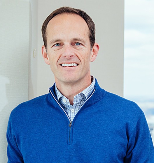 a man in a blue sweater