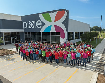 a group of people standing in front of a building