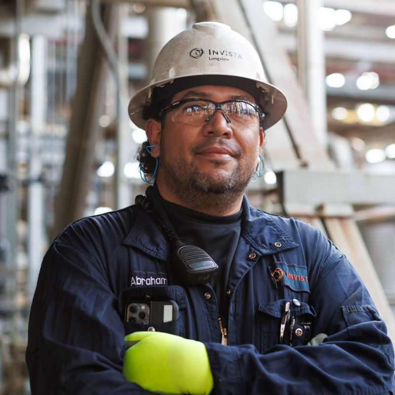 a man wearing a hard hat and glasses