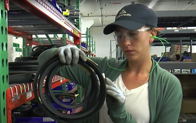 a woman holding a black rubber band