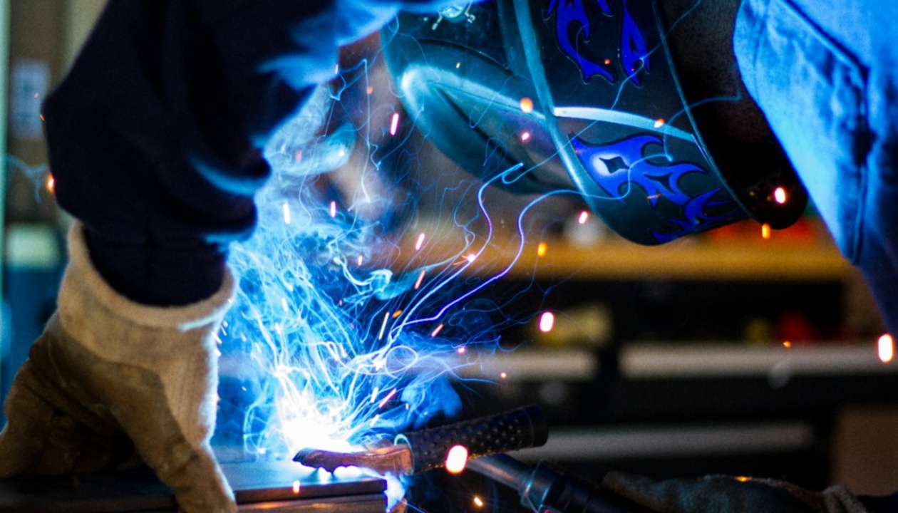 a person welding a piece of metal