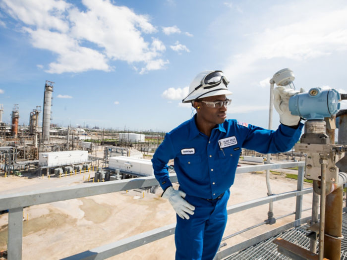 a man wearing a hard hat and gloves