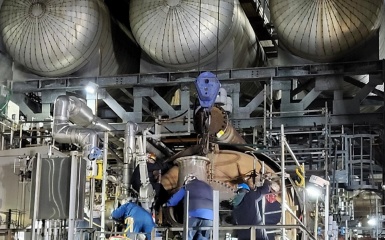 a group of men working on a machine