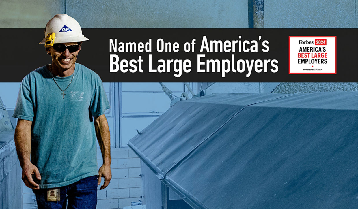 Georgia-Pacific employee with sunglasses and a hardhat at a facility, with the Forbes America