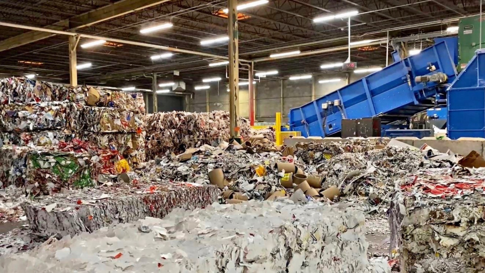 A dump truck unloads mixed paper stock at a Georgia-Pacific facility. 