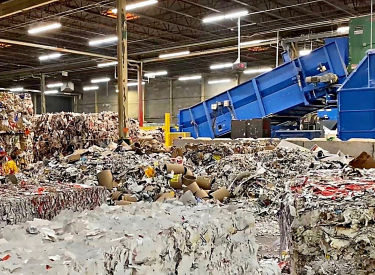 a large pile of paper in a warehouse