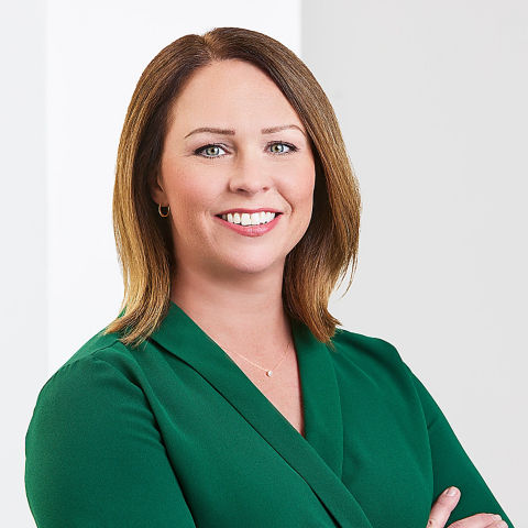 a woman in a green shirt