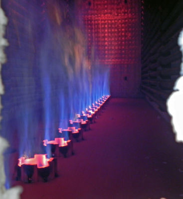 a row of candles with blue and red flames