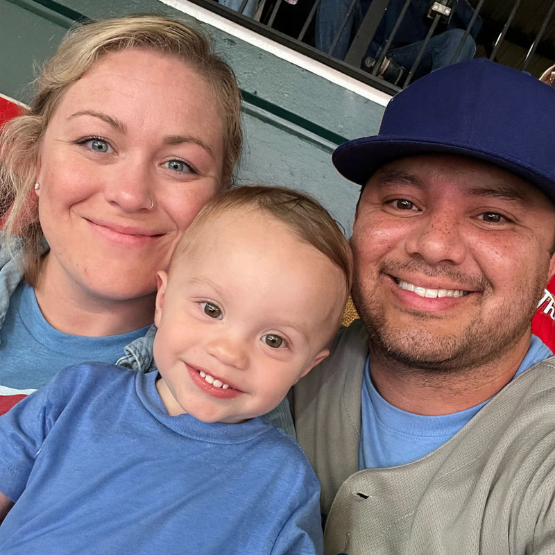 a man and woman with a baby