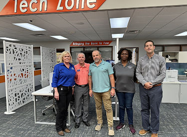 a group of people standing in a room