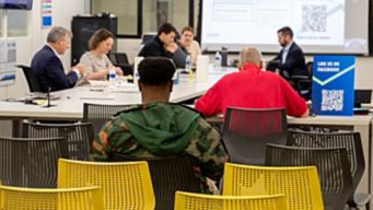 a group of people sitting at a table