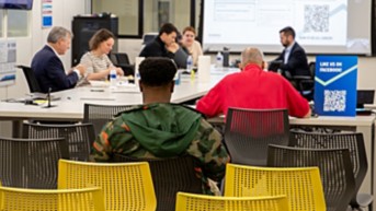 a group of people sitting at a table
