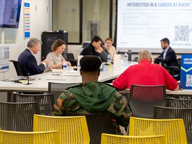 a group of people sitting at a table