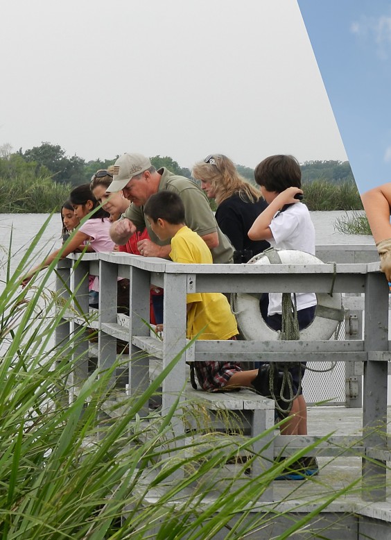 a group of people standing on a bridge