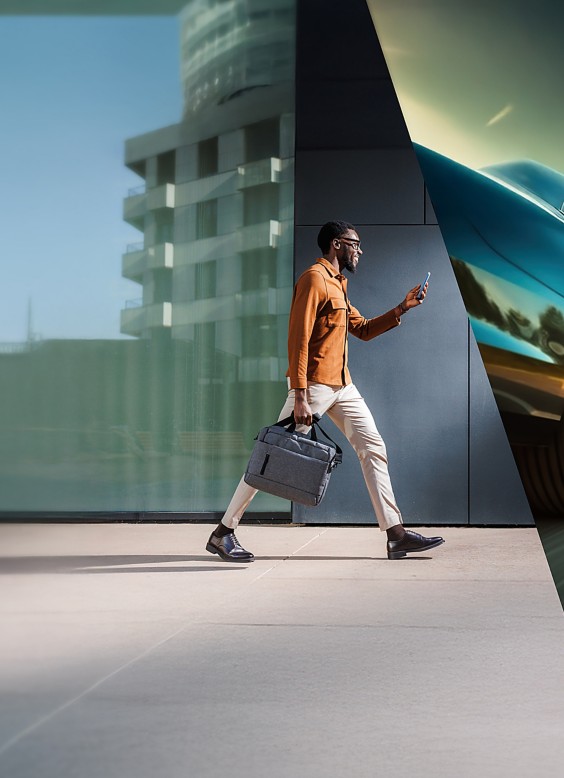 a man walking with a briefcase